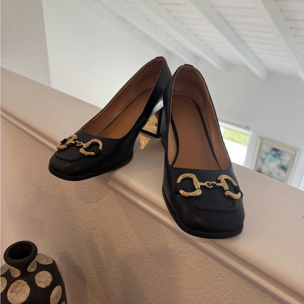 Elegant Black Heels with Gold Accents